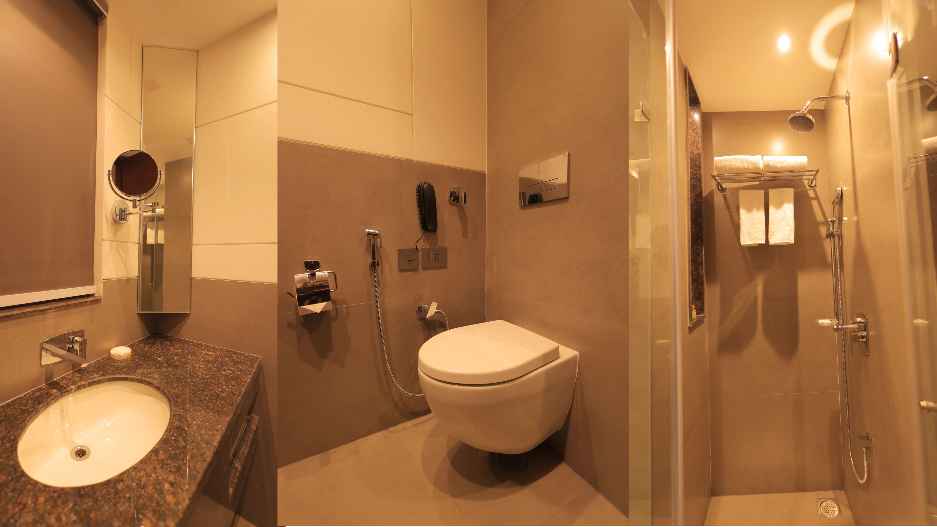 Een badkamer met wastafel, toilet en douche.