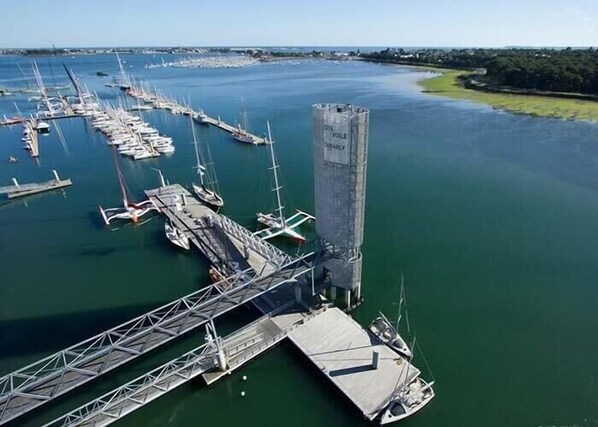 An aerial view of a marina with multiple docks and boats.