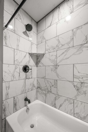 Shower, hair dryer, towels, shampoo