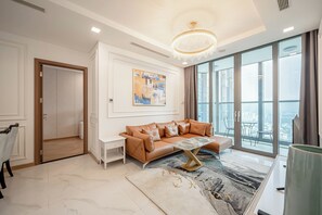 Premier Apartment | Living area | 32-inch flat-screen TV with cable channels, Netflix, streaming services - Isabelle Luxury inside Landmark 81 Tower (Ho Chi Minh City)