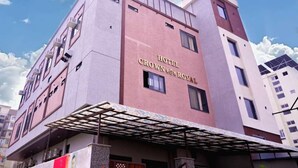 A multi-story hotel with a prominent sign reading "Hotel Crown Royal". - Hotel Crown Royal (Kota)