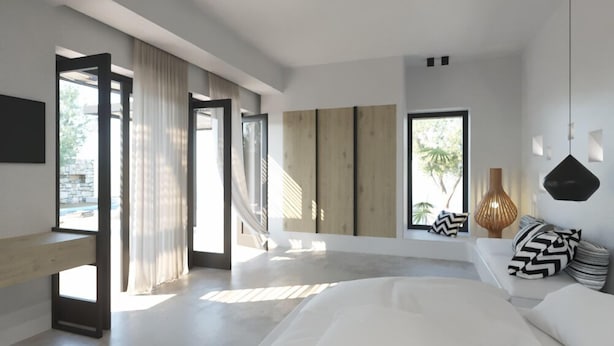 A modern bedroom with a large bed, a wooden floor, and a view of the outdoors. - Ios Bliss (Ios)