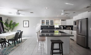 Enjoy meals in the kitchen with a central island, sink, and ample counter space.