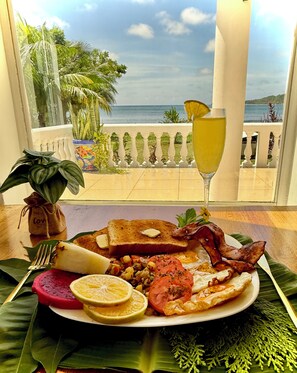 Breakfast, lunch, dinner served; Fusion cuisine, beach views 