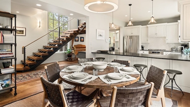 A modern kitchen with white cabinets, a central island, and pendant lighting. - Family-Friendly East Aspen Retreat with Hot Tub, Views & Minutes to Downtown (Aspen)
