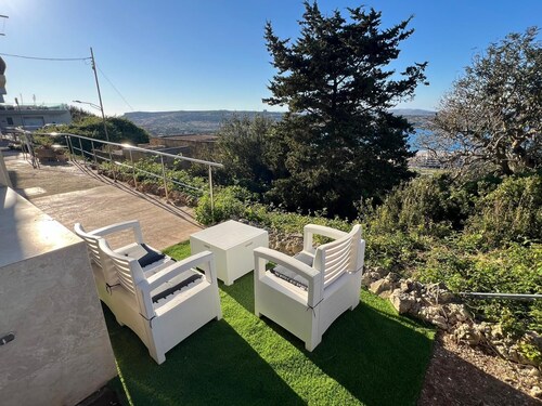 Coastal charm awaits! Elegant Mellieħa maisonette with stunning sea views over Għadira Bay.