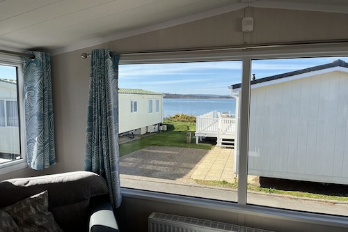 Safari Sunset caravan + sea view at Rockley Park, Poole Harbour. Dogs stay free!