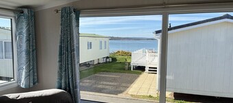 Safari Sunset caravan + sea view at Rockley Park, Poole Harbour. Dogs stay free!