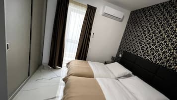 2 quartos, ferros/tábuas de passar roupa, Wi-Fi de cortesia