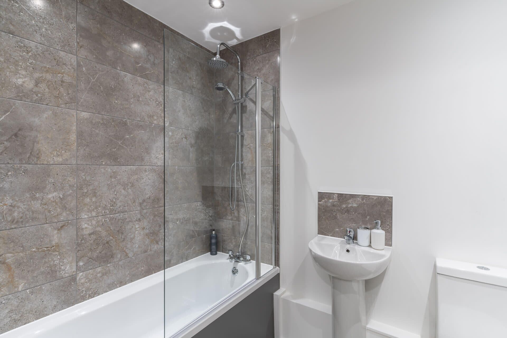 Shower, hair dryer, towels, shampoo