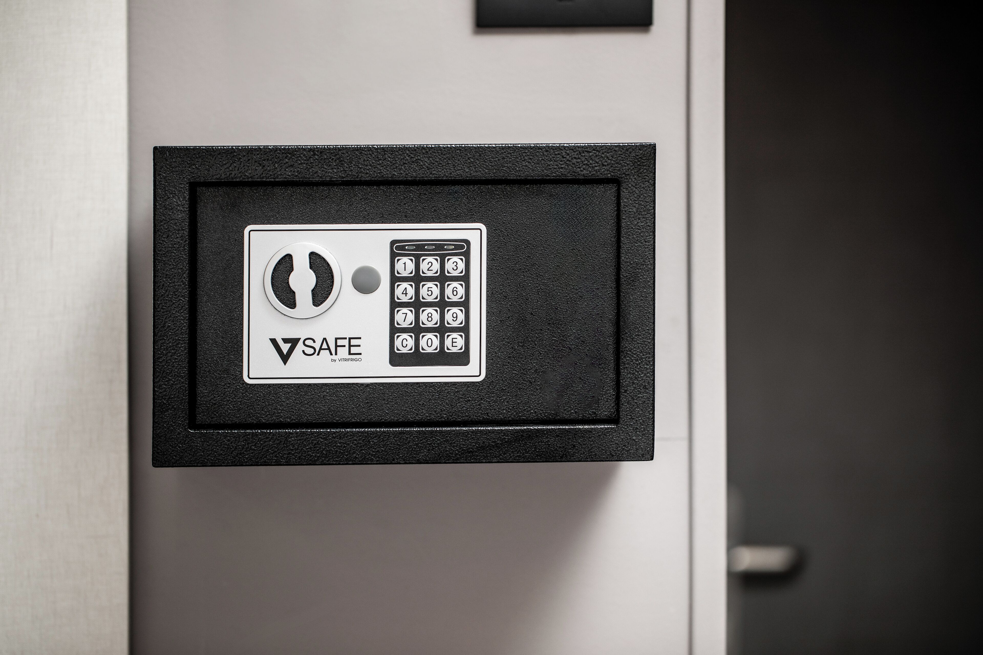 A safe with a keypad and a logo that reads "SAFE by VIBRIGO".