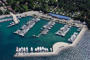 An aerial view of a marina with multiple docks and boats.