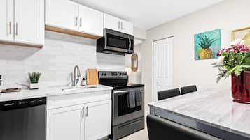 Fridge, coffee/tea maker, cookware/dishes/utensils