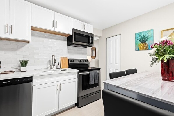 Fridge, coffee/tea maker, cookware/dishes/utensils