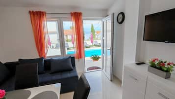 Apartment (Two Bedroom Apartment with Terrace an) | Living room | 32-inch flat-screen TV with digital channels