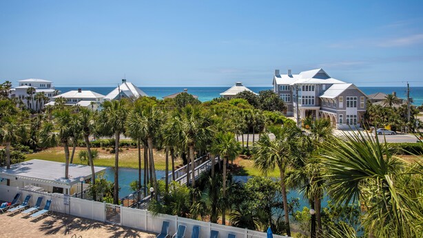 A coastal resort with multiple villas, a swimming pool, and palm trees. - Gulf View, Community Pool, Tennis, Beach Access (Santa Rosa Beach)