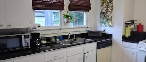 Fridge, microwave, stovetop, coffee/tea maker