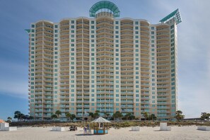 Experience the unique architectural design of this high-rise hotel, featuring a series of balconies and a distinctive curved roof element.