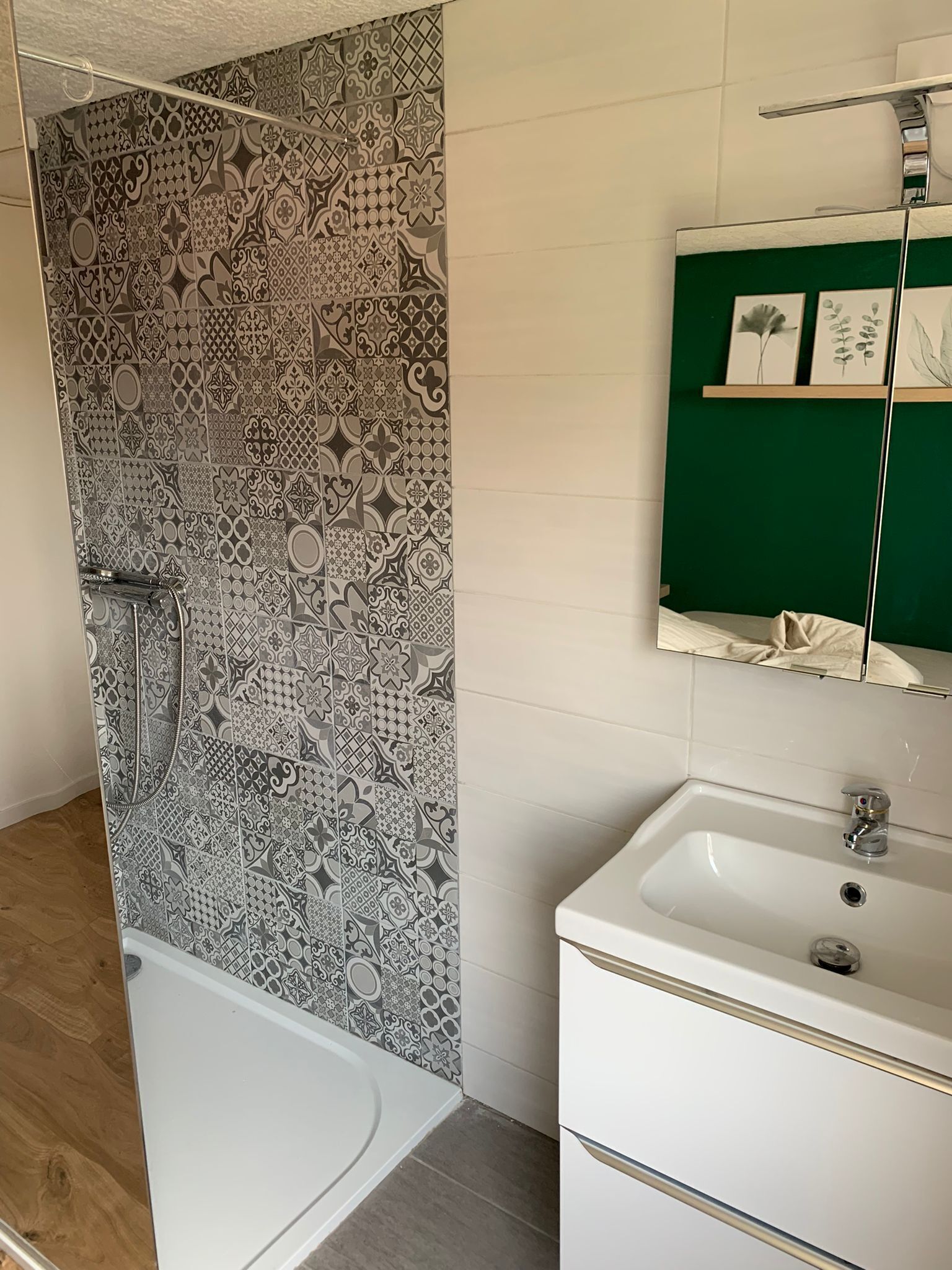 A bathroom with a shower and a sink.