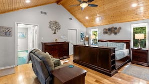 King 1 features a split king adjustable bed, warm pine floors and vaulted wood ceiling. comfortable seating, and direct backyard access.  A spacious closet and private ensuite complete this relaxing retreat.