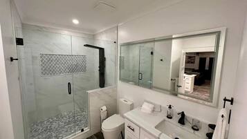 Shower, hair dryer, towels, soap