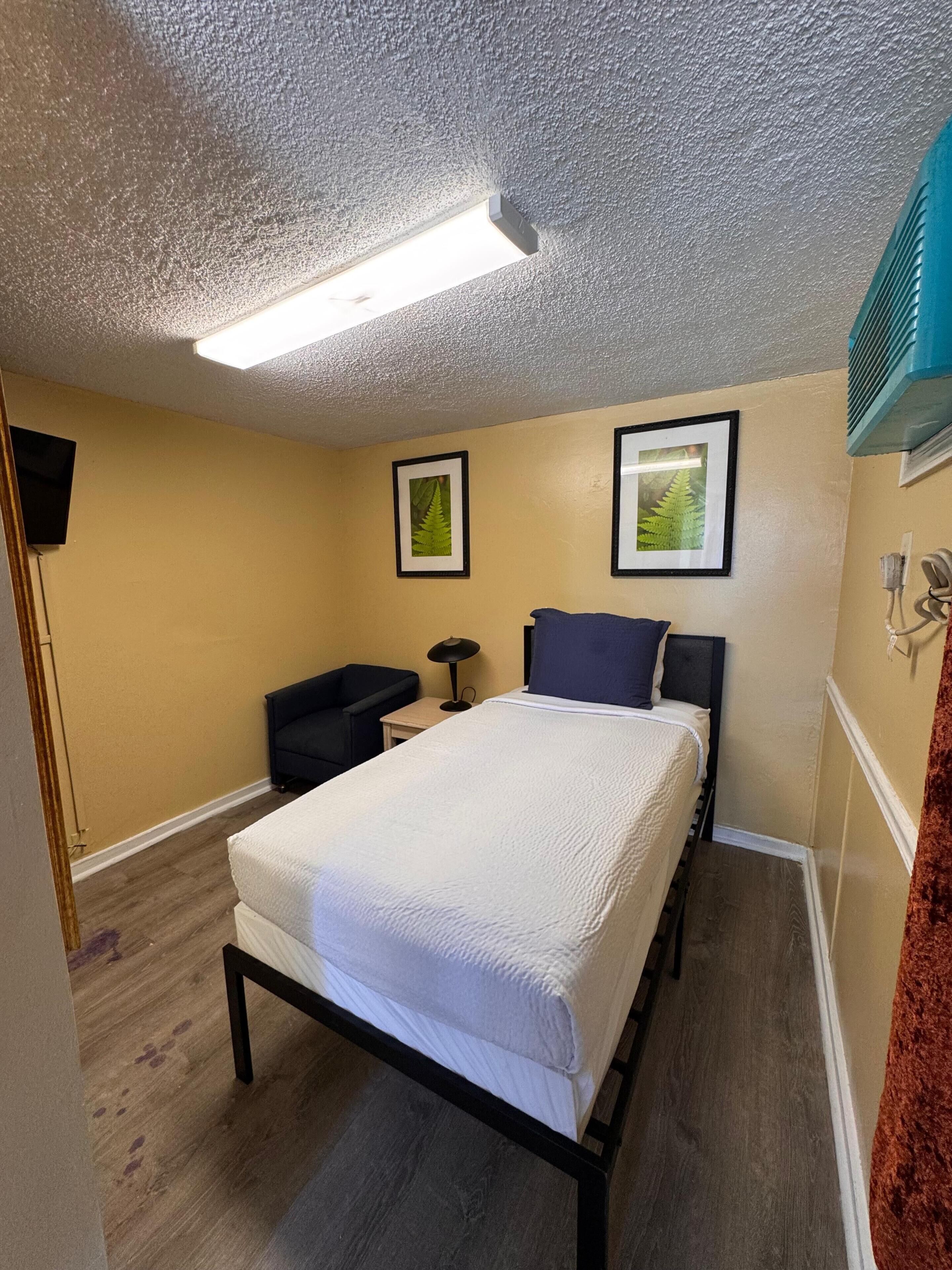 Studio | Desk, bed sheets