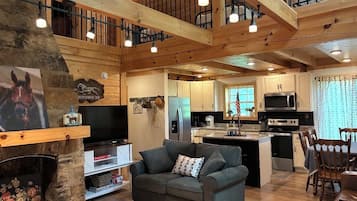 Smart TV, fireplace, books, stereo