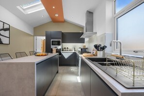 Fridge, microwave, oven, stovetop - Stylish 4-BR House with Parking, Central location (Farnworth)