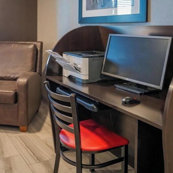 A workspace with a desk, computer, printer, and a chair. - Cozy 1-bedroom hotel in delightful Huntersville up to 2 people (Huntersville)