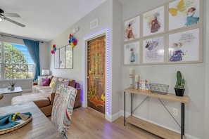 Living area - Poolside/waterpark in backyard. 1st floor Encanto theme w/Arcade next to Disney! (Kissimmee)