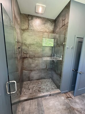 Shower, hair dryer, towels, toilet paper