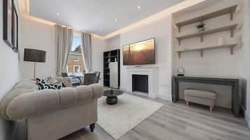 Design Apartment | Living area | 40-inch Smart TV with digital channels