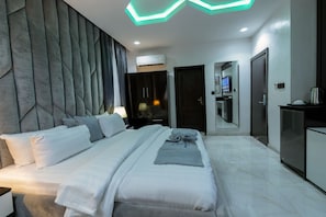 Deluxe Room, City View | In-room safe, desk, laptop workspace, blackout drapes - BRIMUYO HOTEL (Lagos)