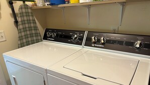 A front view of a Speed Queen brand front-loading washer and dryer set in a laundry room. - Cozy house in quiet SML community. Close to State Park, wineries, Bridgewater. (Moneta)