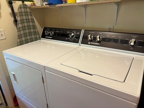 A front view of a Speed Queen brand front-loading washer and dryer set in a laundry room. - Cozy house in quiet SML community. Close to State Park, wineries, Bridgewater. (Moneta)