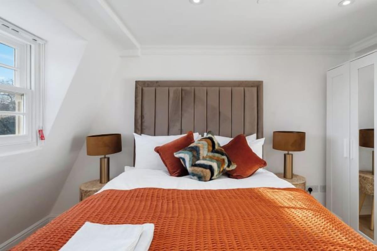 Laptop workspace, blackout curtains, iron/ironing board, bed sheets