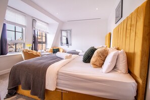 1 bedroom, desk, iron/ironing board, travel crib