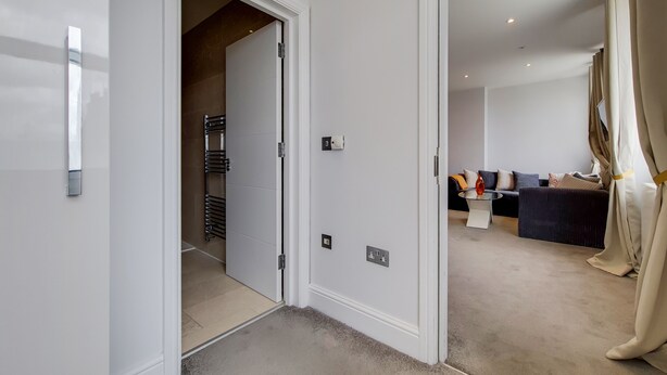 A modern interior with a hallway leading to a living area. - The Marylebone Residences (London)