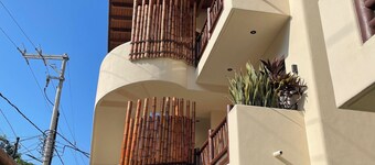 Brand new condo with an enclosed patio a private pool and lush garden.