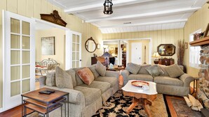 A cozy living room with two sofas, a coffee table, and a fireplace. - THE Winding Lane House EST 1932 #2360 (Big Bear City)