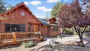 A log cabin with a porch and a stone pathway leading to the entrance. - THE Alps Lodge #2142 (Big Bear Lake)