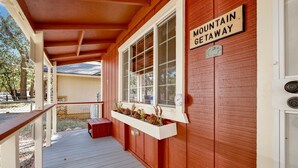 A wooden exterior with a sign reading "Mountain Getaway". - Mountain Getaway#2183 (Sugarloaf)