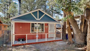 A small, single-story cabin with a gabled roof, a chimney, and a porch. - Mountain Getaway#2183 (Sugarloaf)