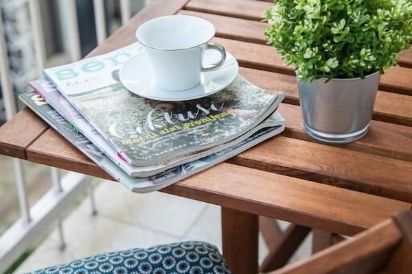 The cozy and bright balcony perfect to enjoy a good morning coffee!