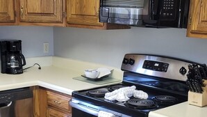 Coffee/tea maker, fridge, microwave, oven