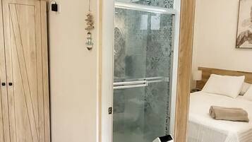 Shower, hair dryer, towels, soap