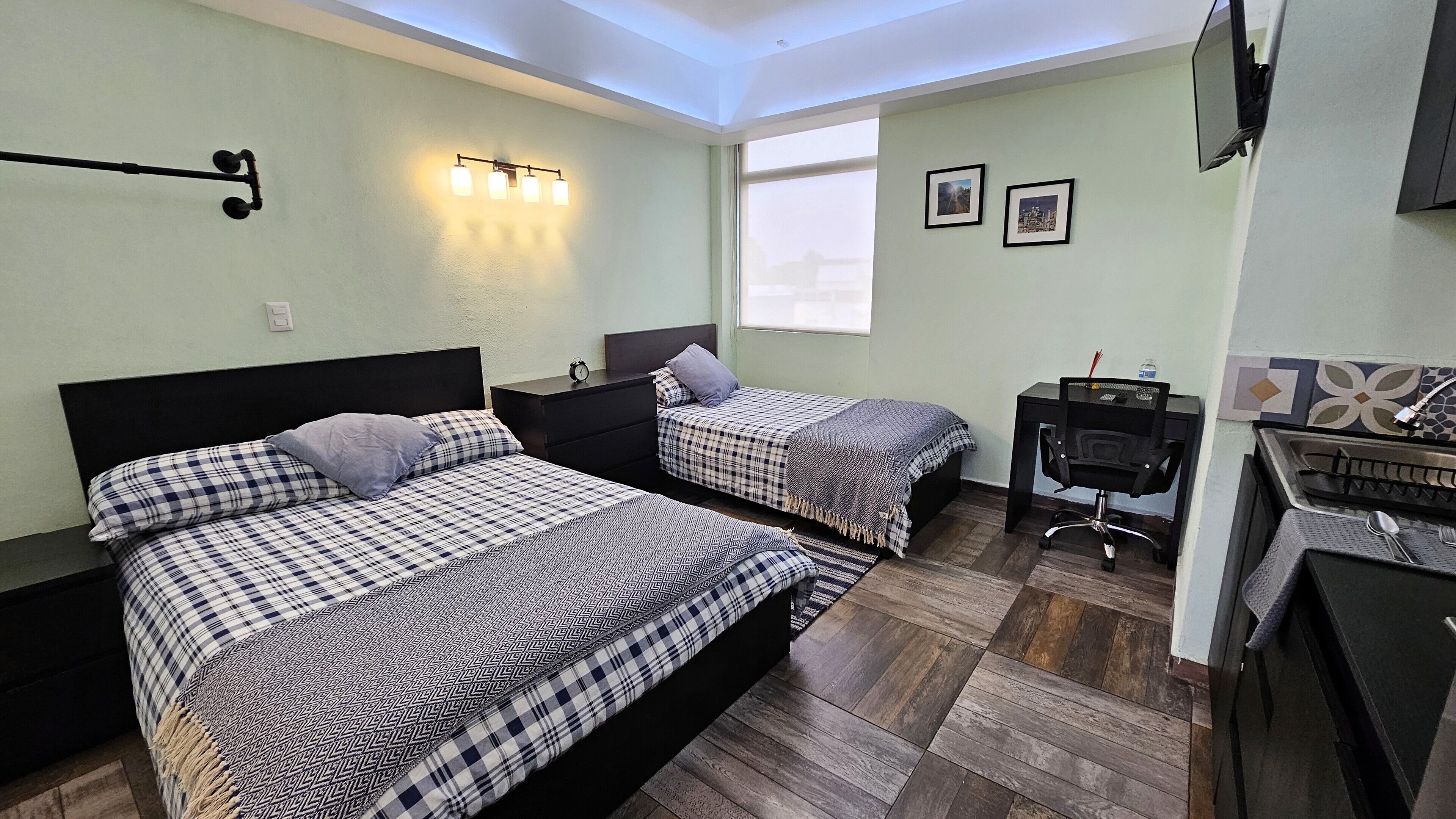 Family Studio Suite | In-room safe, individually decorated, individually furnished, desk