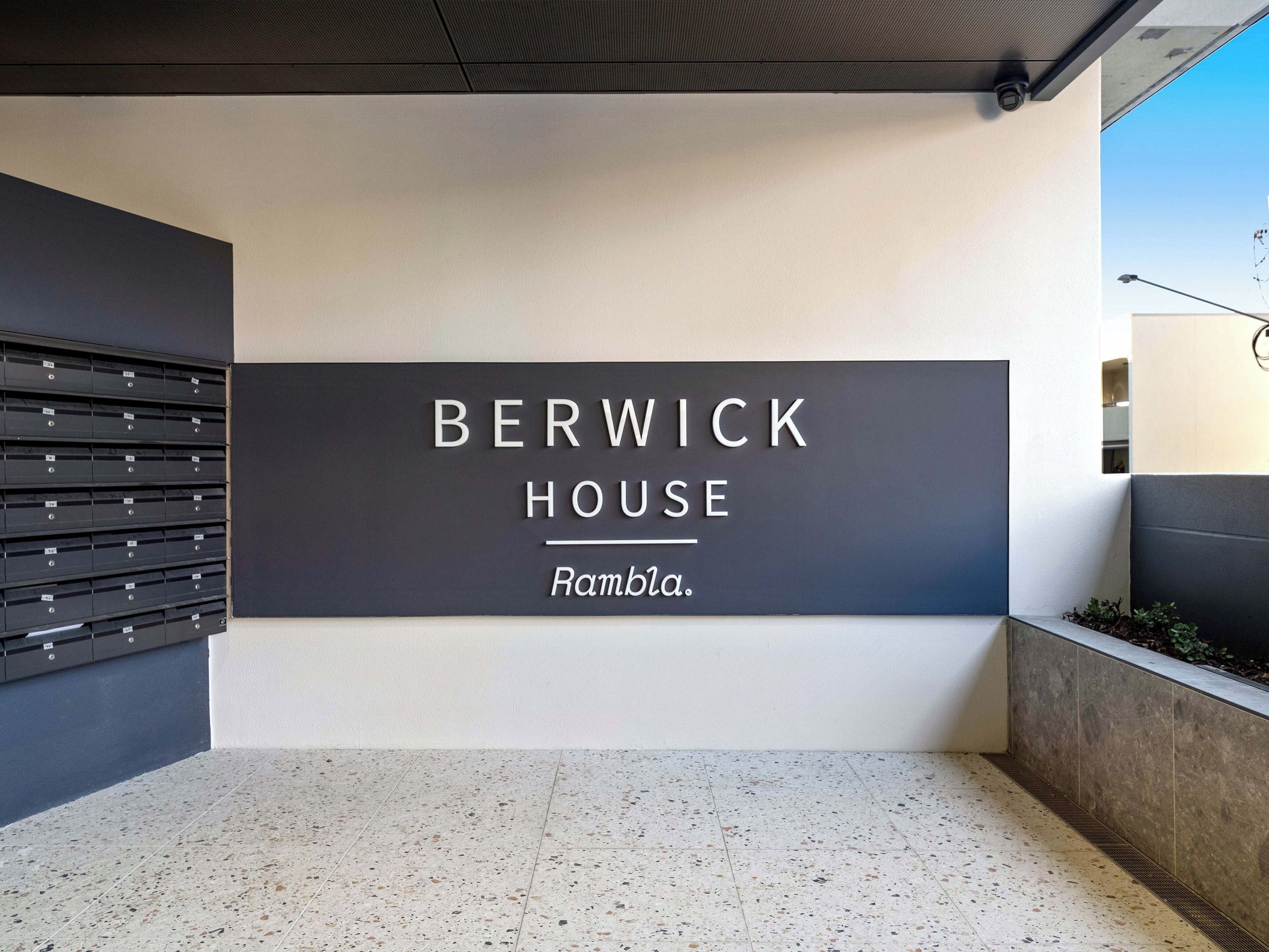 A modern building facade with a sign reading "BERWICK HOUSE Ramblia."