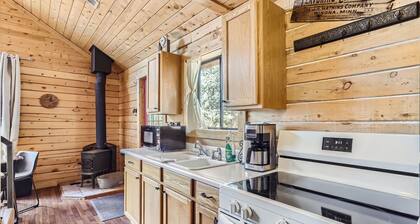 Mountain Cabin surrounded by woods and views.