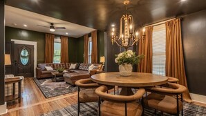 A dining area with a round table, chairs, and a chandelier. - “Bourbon Trail Beauty” (Lawrenceburg)